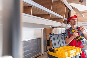 A photo of a worker holding a power tool
